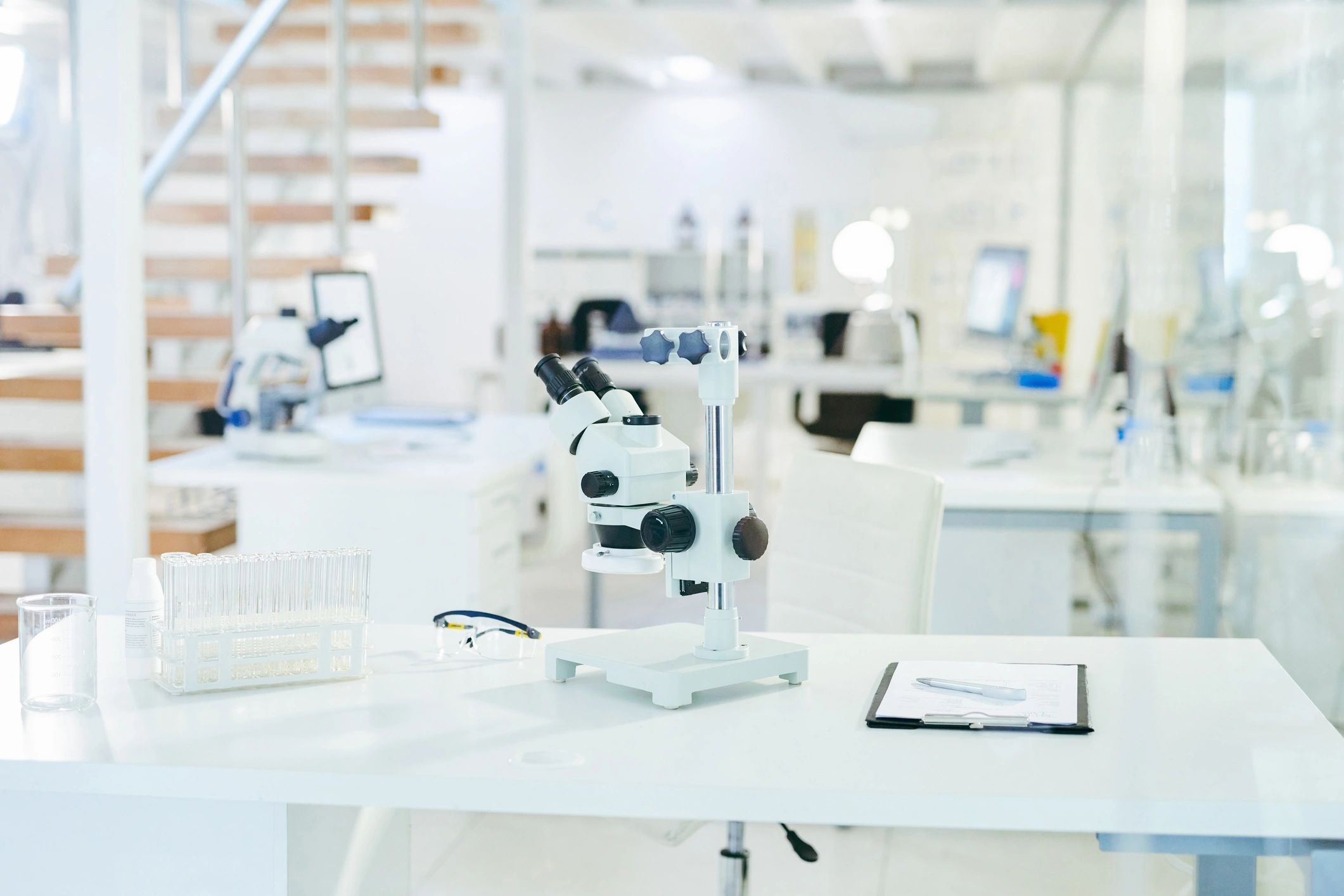 Tablet on a lab bench showing scientific equipment and documentation