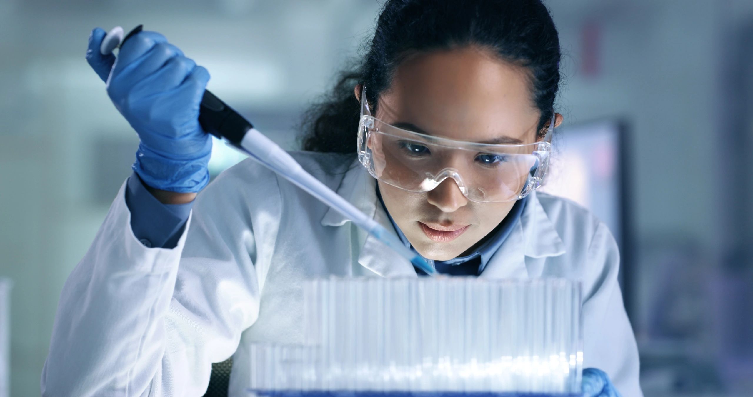 Scientist organizing lab materials representing careful research workflow